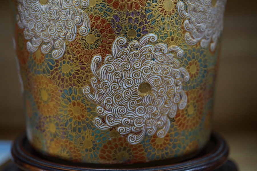 A Japanese Satsuma pottery lidded jar, Meiji period, decorated and gilded with flowers, signed to the base, 14cm high. Condition - lid restored